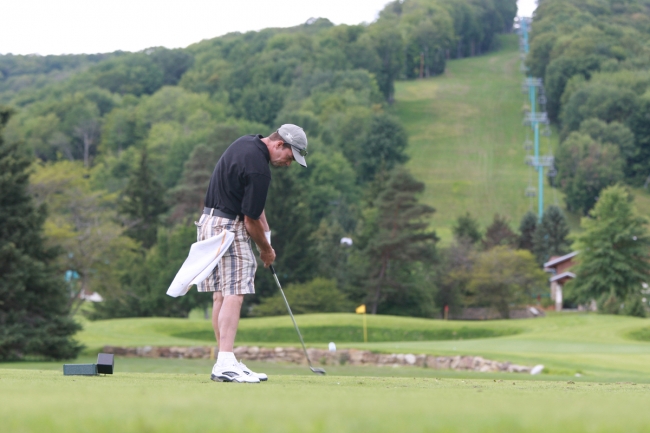 Man golfing at Holiday Valley