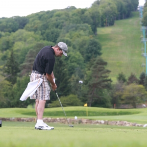 Man golfing at Holiday Valley